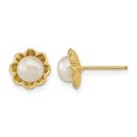 A pair of gold stud earrings featuring round white pearls set in floral-shaped gold settings, shown from front and side views.