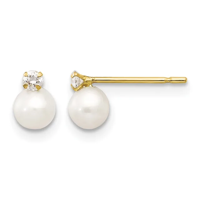 A pair of gold stud earrings, each featuring a round white pearl topped with a small round diamond in a gold setting.