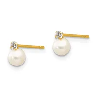 A pair of gold stud earrings with round white pearls suspended below small round diamond settings.