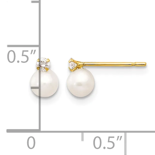 Pair of gold stud earrings featuring white pearl drops topped with small diamond accents, shown next to a measurement scale indicating approximately 0.5 inches in length.