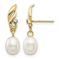 Pair of gold drop earrings with twisted leaf-shaped tops, small round diamonds, and dangling white pearl drops, shown from front and side views.