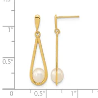 Pair of gold teardrop earrings with pearl drops, shown front and back view against a measurement ruler.