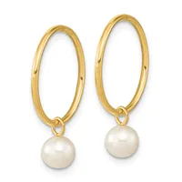 A pair of gold hoop earrings with white pearl drops attached to the bottom of each hoop.