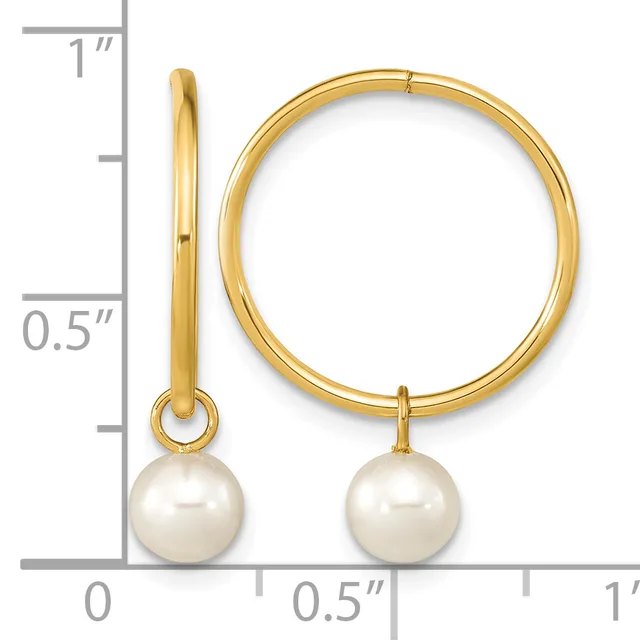 Gold hoop earrings with white pearl drops, shown from front and side views against a ruler measuring approximately one inch in diameter.
