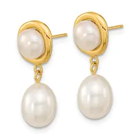 A pair of gold-toned drop earrings with oval pearl studs on top and larger dangling pearl drops below, connected by small chain links.