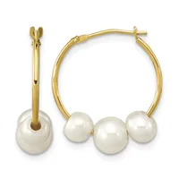Gold hoop earrings with three white pearl charms suspended from each hoop, shown from front and side views.