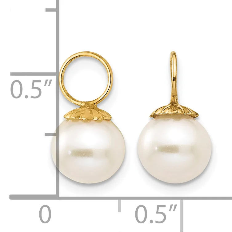 Two gold pearl drop earrings with round white pearls suspended from decorative gold caps, displayed against a measurement scale.