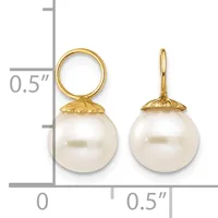 Two gold pearl drop earrings with round white pearls suspended from decorative gold caps, displayed against a measurement scale.