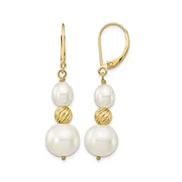 A pair of gold lever-back earrings with white pearl drops of varying sizes separated by textured gold beads.