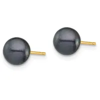 A pair of black pearl stud earrings with gold posts and backs, displayed side by side against a white background.