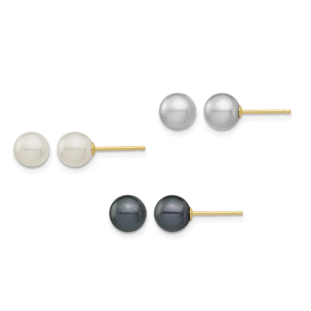 Three pairs of pearl stud earrings with gold posts displayed in a row: white pearls on the left, gray pearls in the center, and black pearls on the right.