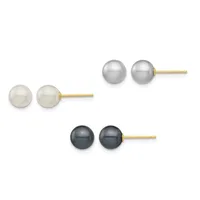 Three pairs of pearl stud earrings with gold posts displayed in a row: white pearls on the left, gray pearls in the center, and black pearls on the right.