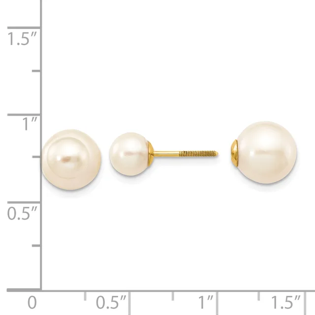 Two cream-colored pearl stud earrings on a gold post shown next to a ruler for scale, with the pearls measuring approximately one inch in diameter.