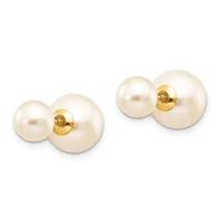 Pair of pearl stud earrings with white round pearls of varying sizes paired with smaller pearls, gold-colored posts and backs.