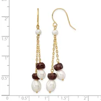 Two gold drop earrings with pearl and garnet beads suspended from chains, shown next to a ruler measuring approximately two inches in length.