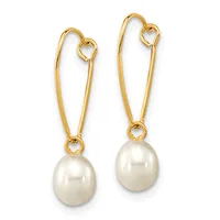 Pair of gold-toned hook earrings with white pearl drops hanging against a white background.