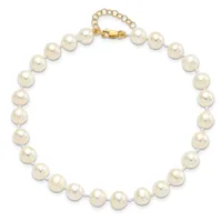 A cream-colored pearl necklace with a gold-toned clasp and extender chain displayed against a white background.