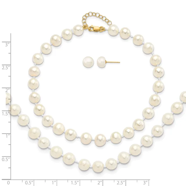 A pearl necklace with a gold clasp displayed next to matching pearl stud earrings, with a measurement ruler showing the necklace is approximately 18 inches long.