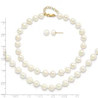 A pearl necklace with a gold clasp displayed next to matching pearl stud earrings, with a measurement ruler showing the necklace is approximately 18 inches long.