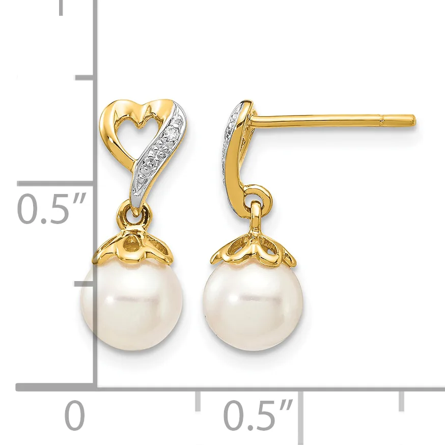 Pair of gold and diamond heart-shaped earrings with dangling white pearl drops, shown with a measurement scale indicating approximately 0.5 inches in length.
