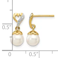 Pair of gold and diamond heart-shaped earrings with dangling white pearl drops, shown with a measurement scale indicating approximately 0.5 inches in length.