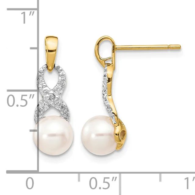 Pair of gold dangle earrings with diamond-accented twisted ribbons suspending white pearl drops, shown front and side view with measurement scale.