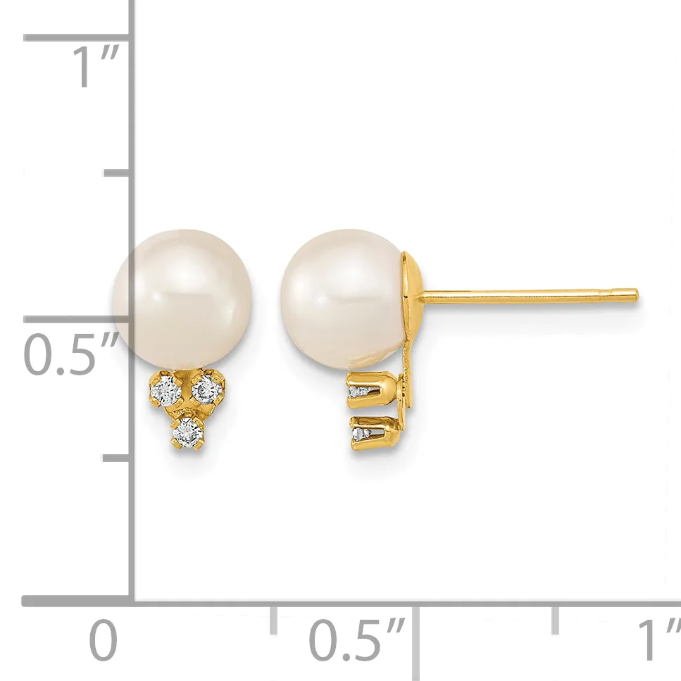 Pair of gold stud earrings with white pearl tops and three small diamond accents below each pearl, displayed against a measurement ruler showing approximately half inch height.