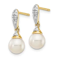 Pair of gold and diamond drop earrings with white pearl pendants, shown against a white background.