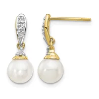 Pair of gold and silver two-tone drop earrings with diamond-accented oval tops and white pearl bottoms, shown front and side view.