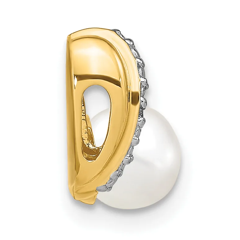 Gold pendant with a curved abstract design featuring a white pearl suspended below, accented with small diamonds along the edge.
