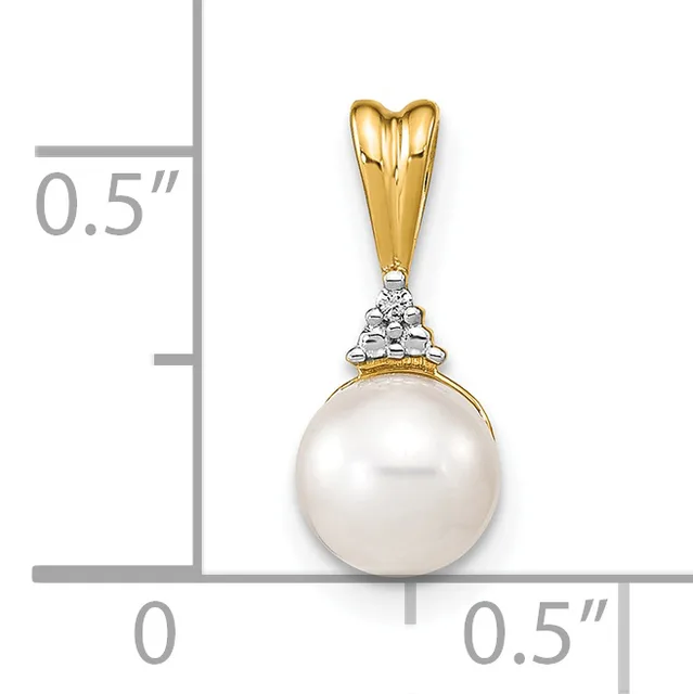 A gold pendant with a white pearl hanging from a decorative bail, shown against a measurement scale indicating approximately half an inch in width and height.