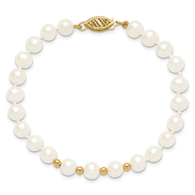 White pearl bracelet with gold-tone spacer beads and an ornate gold-tone clasp, displayed on a white background.