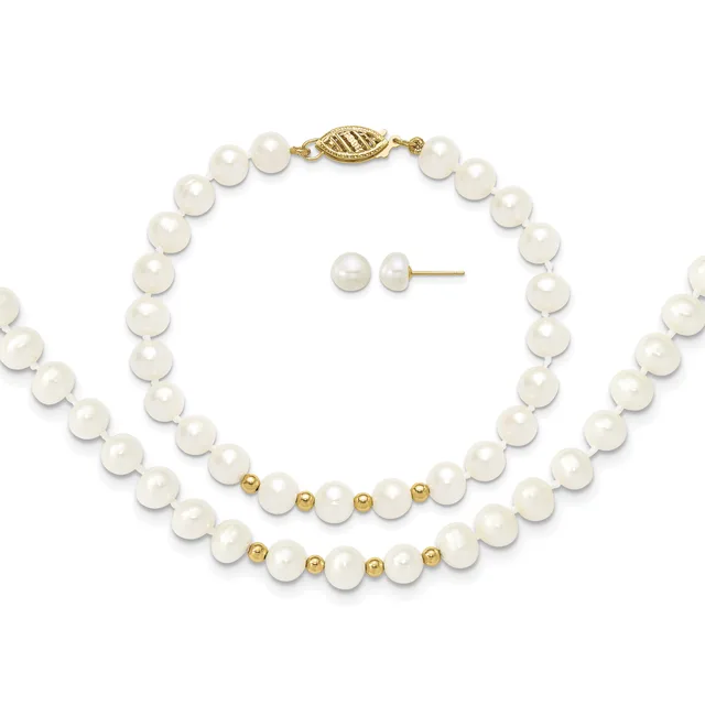 A pearl jewelry set consisting of a long strand necklace with gold-toned spacer beads and clasp, a shorter bracelet with matching pearls and gold beads, and a pair of pearl stud earrings.