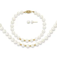 A pearl jewelry set consisting of a long strand necklace with gold-toned spacer beads and clasp, a shorter bracelet with matching pearls and gold beads, and a pair of pearl stud earrings.