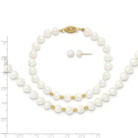 Two-strand pearl bracelet with gold spacer beads and clasp, displayed with matching pearl stud earrings on a measurement grid.