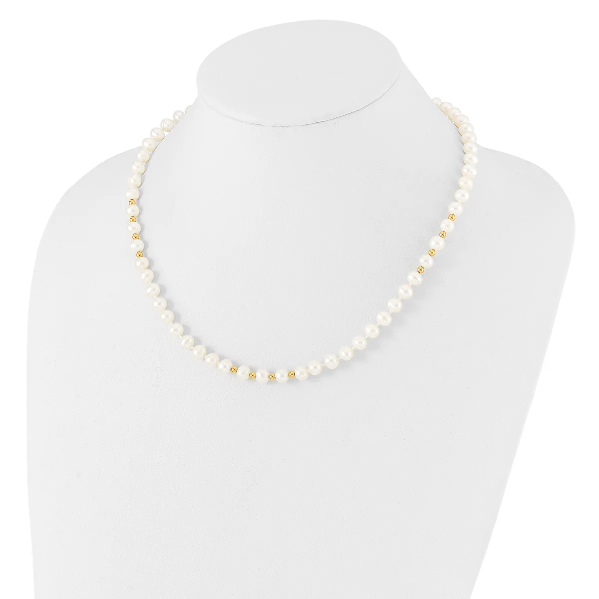 A white pearl beaded necklace with gold-tone spacer beads displayed on a white mannequin bust.