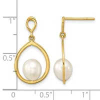 Gold teardrop earrings with white pearl centers, displayed next to a ruler showing approximately one inch in length.
