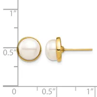 Two round white pearl stud earrings with gold-tone bezels and posts, shown from front and side views with a measurement scale indicating approximately half-inch diameter.