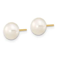 A pair of round white pearl stud earrings with gold posts and backs, displayed side by side against a white background.
