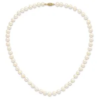 A strand of round cream-colored pearls with a gold-toned clasp, arranged in a closed loop against a white background.