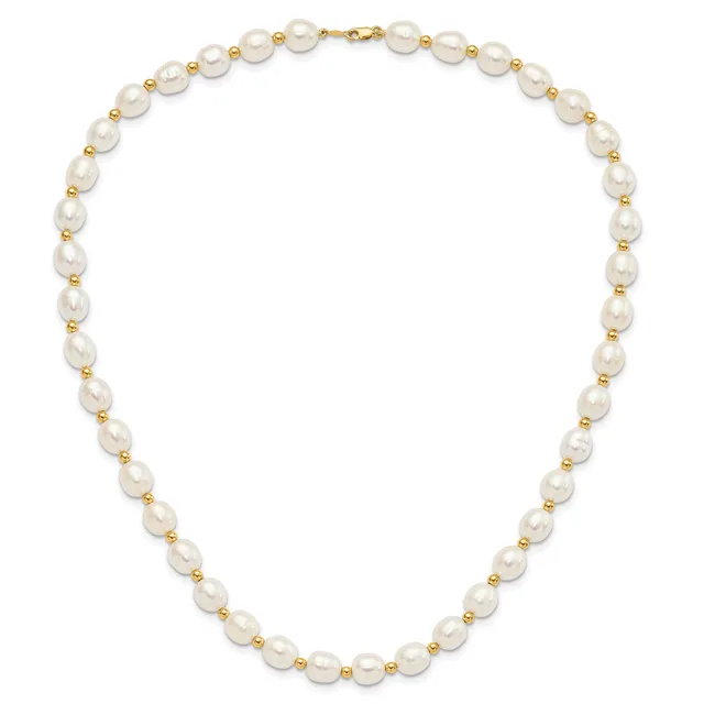 A pearl necklace with alternating white baroque pearls and small gold-tone beads, featuring a gold clasp.