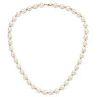 A pearl necklace with alternating white baroque pearls and small gold-tone beads, featuring a gold clasp.