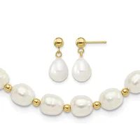 Gold-tone ball stud earrings with white pearl teardrop dangles paired with a bracelet of white pearls separated by small gold-tone beads.