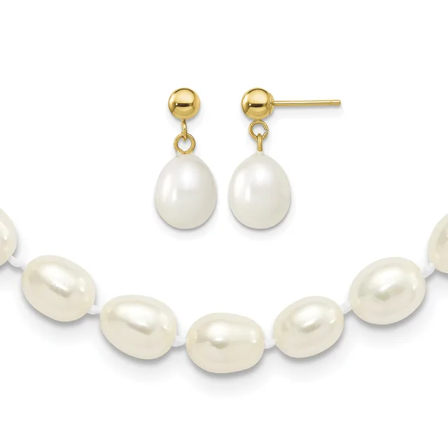 Gold ball stud earrings with dangling white pearl drops, displayed above a matching bracelet of connected white pearls with gold spacers.