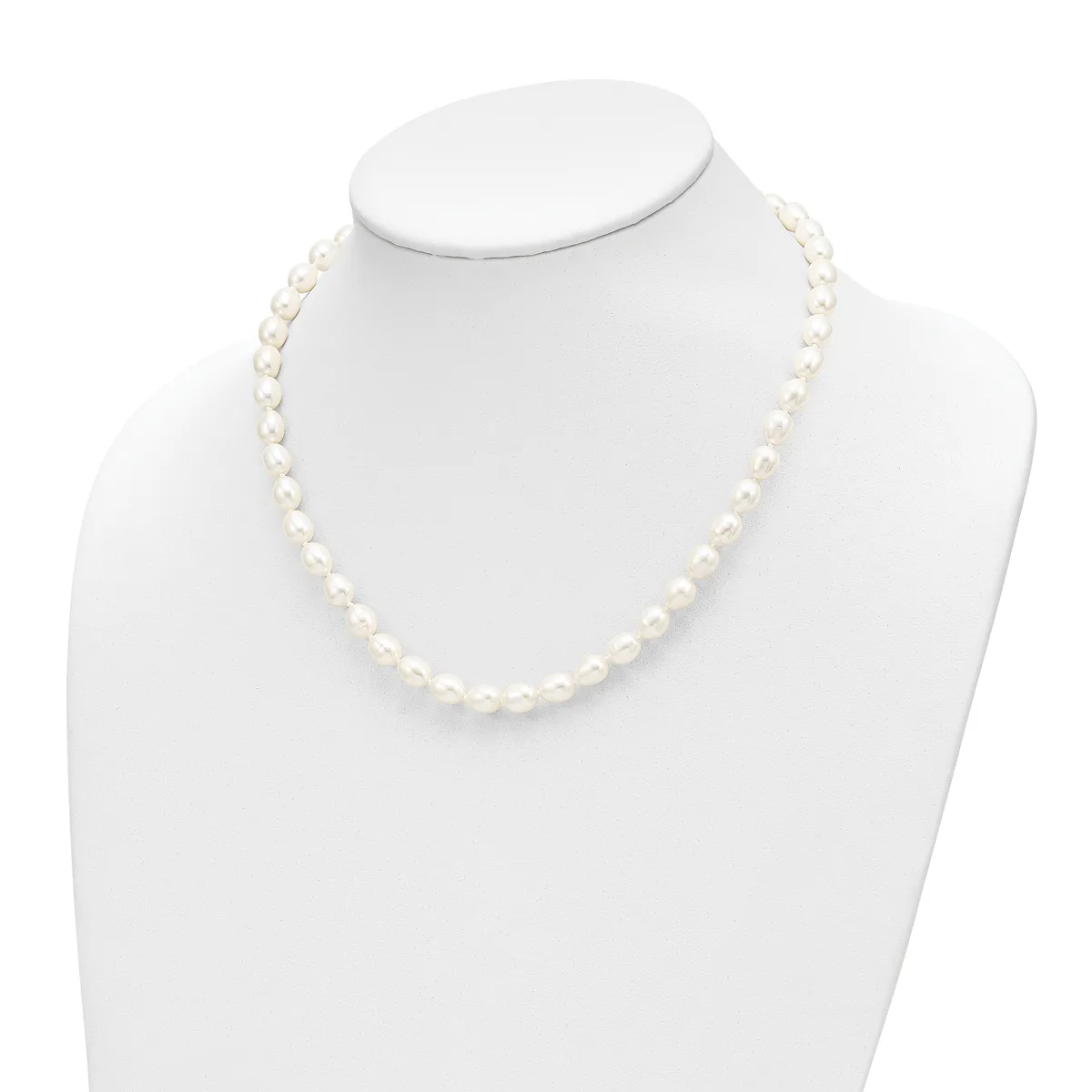 A strand of white pearl beads displayed on a white mannequin neck form against a white background.