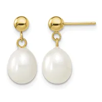 A pair of gold ball stud earrings with white pearl drops hanging from small loops.