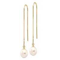 Pair of gold threader earrings with long delicate chains and white pearl drops suspended from curved wire tops.