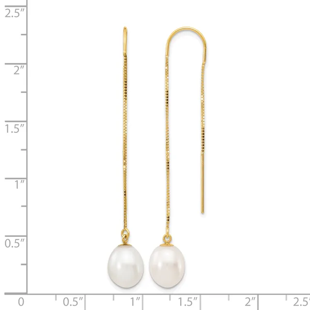 Two gold threader earrings with white pearl drops, displayed against a measurement scale showing they are approximately two inches long.
