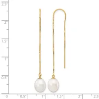 Two gold threader earrings with white pearl drops, displayed against a measurement scale showing they are approximately two inches long.