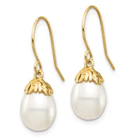 Pair of gold fishhook earrings with white pearl teardrop pendants topped by decorative gold leaf-shaped caps.